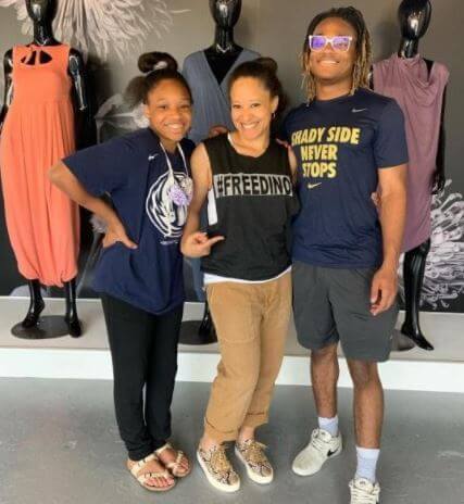 Michael Dean Tomlin brother Mason and sister Harlyn and mom Kiya at Kiya Tomlin clothing store.